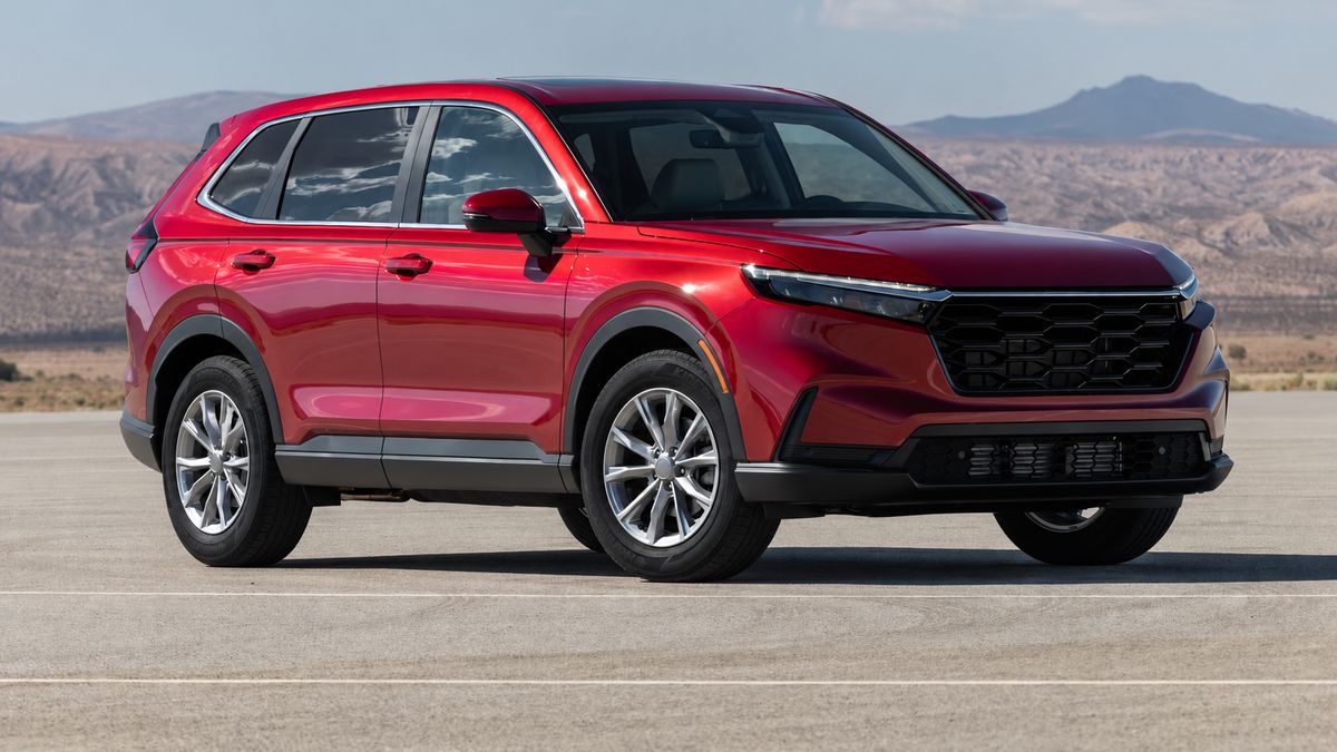 Red SUV parked on open road